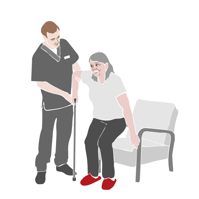 Man taking care of elderly woman and helping her standing up